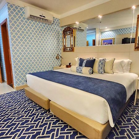 Golden Lis Hotel Boutique Goiania Bagian luar foto A bedroom at the hotel