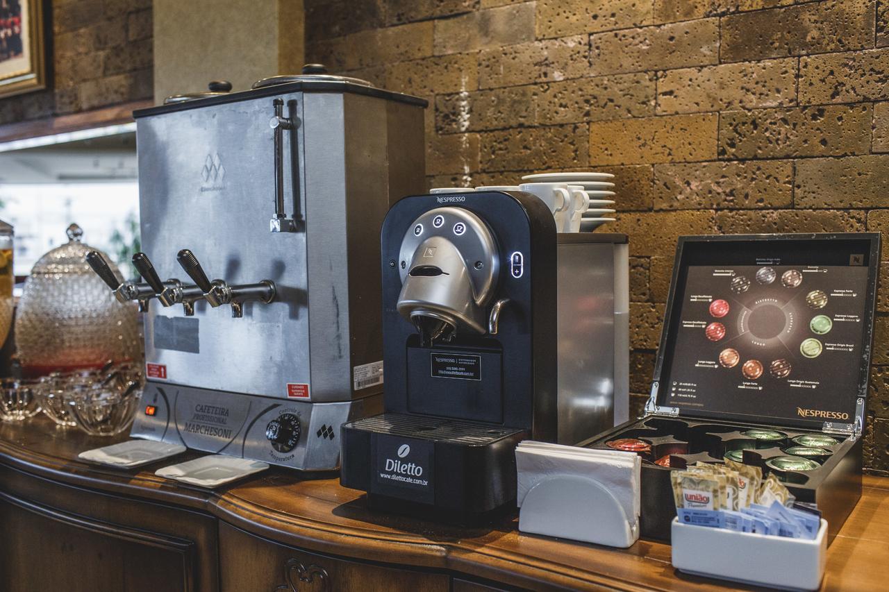 Golden Lis Hotel Boutique Goiania Bagian luar foto A single serve coffee machine